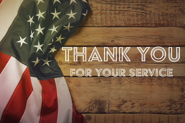 Text THANK YOU FOR YOUR SERVICE and American flag on wooden background, top view. Memorial day - Фото, зображення