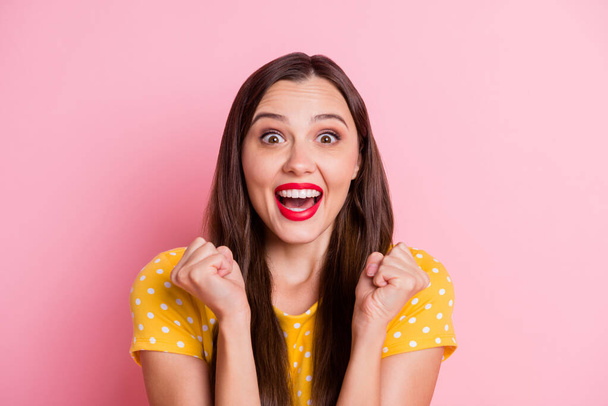 Photo of young attractive girl excited happy smile celebrate win victory fists hands isolated over pink color background - 写真・画像