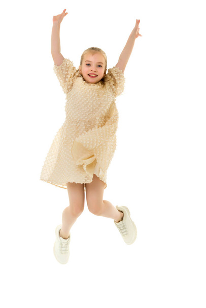 The little girl is jumping fun.The concept of a good mood, summer vacation. - Foto, Imagen