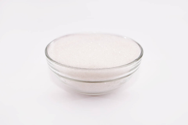 Sugar - sand in a glass bowl on a white background - Foto, Imagem