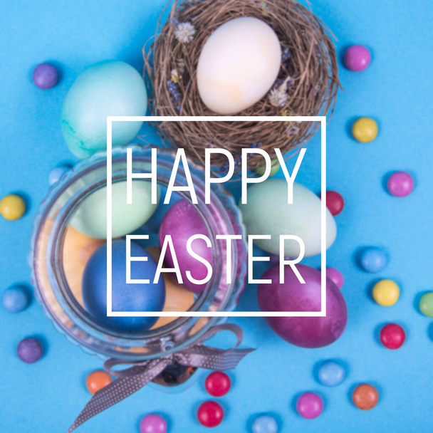 Барвистий фон з великодніми яйцями на синьому фоні. Зі святом Великодня. Може використовуватися як плакат, фон, святкові листівки. Студія Фото
 - Фото, зображення