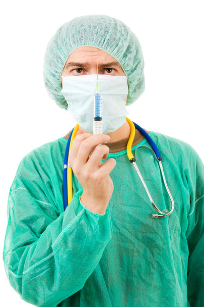 jonge chirurg met een spuit, geïsoleerd op wit - Foto, afbeelding