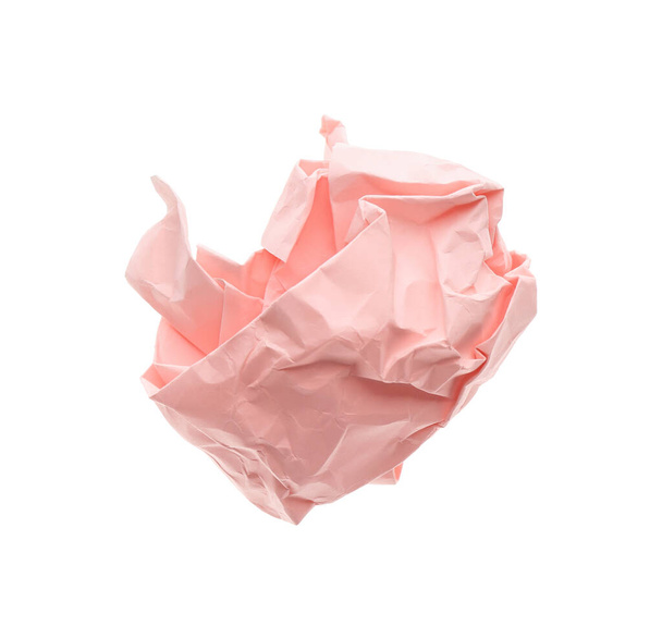 Crumpled sheet of light pink paper isolated on white, top view - Photo, Image