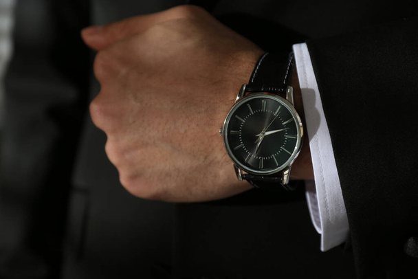 Businessman in suit with luxury wrist watch, closeup - 写真・画像