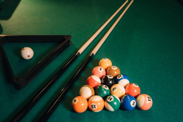 Billiard table with green surface and balls in the billiard club.Pool Game. - Fotoğraf, Görsel