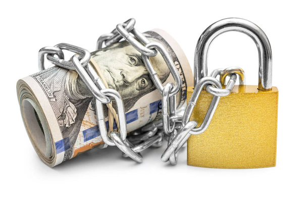 Dollar bills wrapped by chain and secured with padlock. Isolated on white. Safety money and investment concept. - Photo, Image