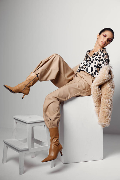 pretty woman in leopard shirt trendy autumn style studio - Photo, Image
