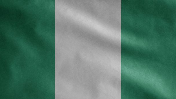Bandera nigeriana ondeando en el viento. Primer plano de Nigeria bandera que sopla, suave y suave seda. Tejido de tela textura ensign fondo. - Foto, Imagen