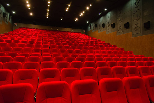An empty cinema room with red velvet seats. Empty cinema. - Photo, Image