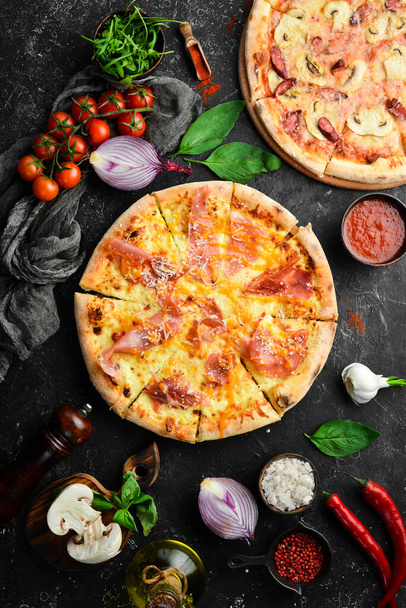Delicious pizza with cheese and prosciutto. Top view. Food delivery. - Φωτογραφία, εικόνα
