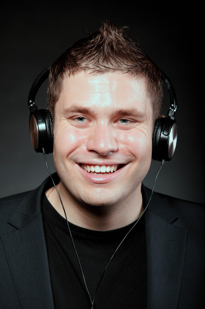 young man with headphones listening to music - Φωτογραφία, εικόνα