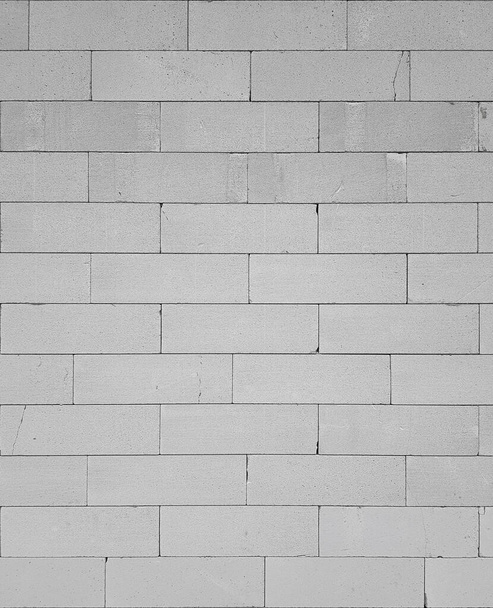 Un fragmento de una pared blanca hecha de bloques, mampostería áspera, textura o papel pintado - Foto, imagen
