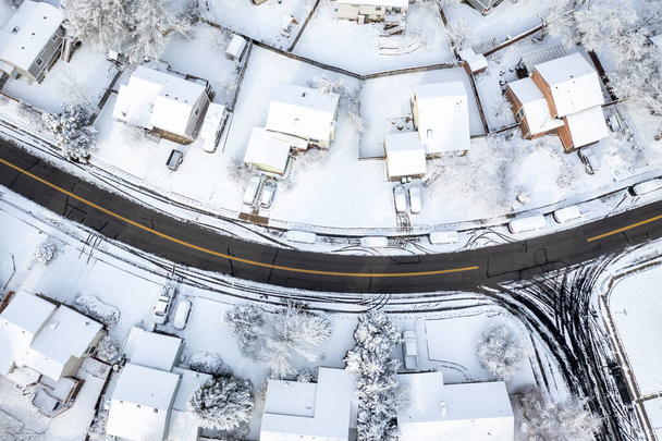 street in a residential area of Fort Collins in northern Colorado after springtime snowstorm, aerial view - Photo, image