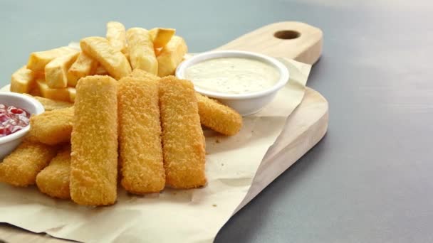 Fried fish meat finger sticks with sauce - Footage, Video