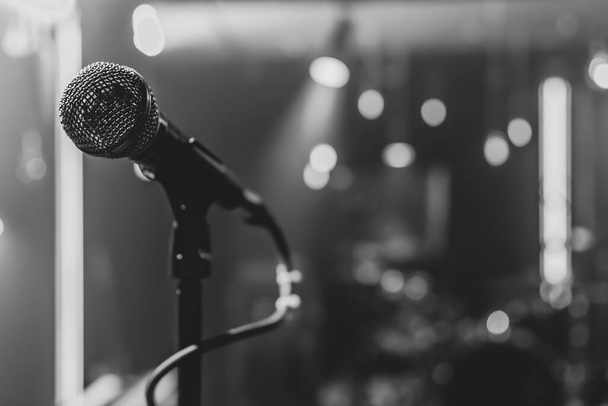 Close up of a microphone on a concert stage with beautiful lighting. - 写真・画像