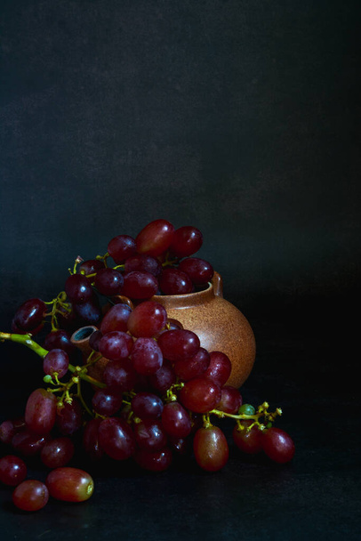 Red grape fruit on natural dark background. - Zdjęcie, obraz