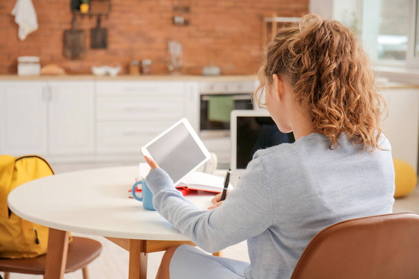 Female student studying online at home - Photo, Image