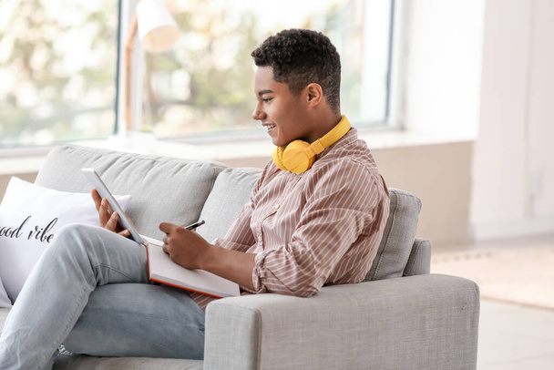 African-American student studying online at home - Photo, Image