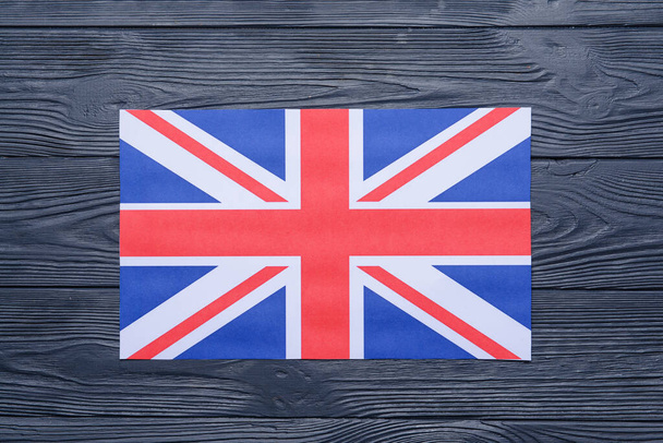 National flag of the United Kingdom on wooden background - Foto, Imagen