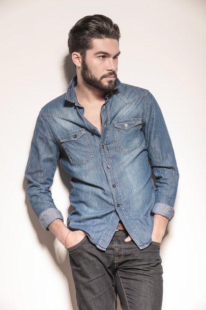 side view of a relaxed young man in jeans clothes - Photo, Image