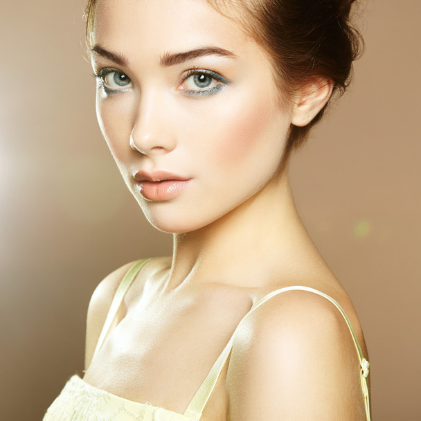 Portrait of young beautiful girl with brown hair. - Фото, зображення