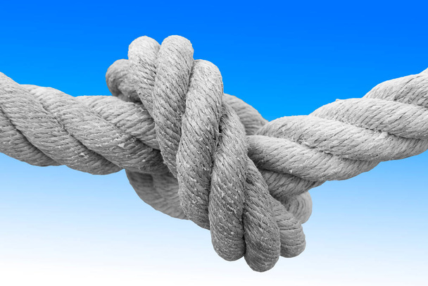 単結びの強いロープ-青と白の背景に対する概念的なイメージ. - 写真・画像