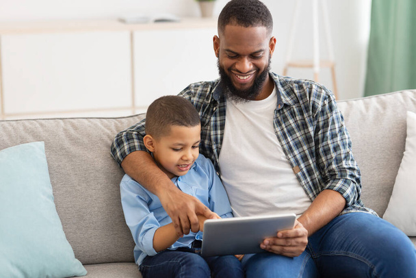 African American Dad And His Kid Using Digital Tablet Indoor - Photo, Image
