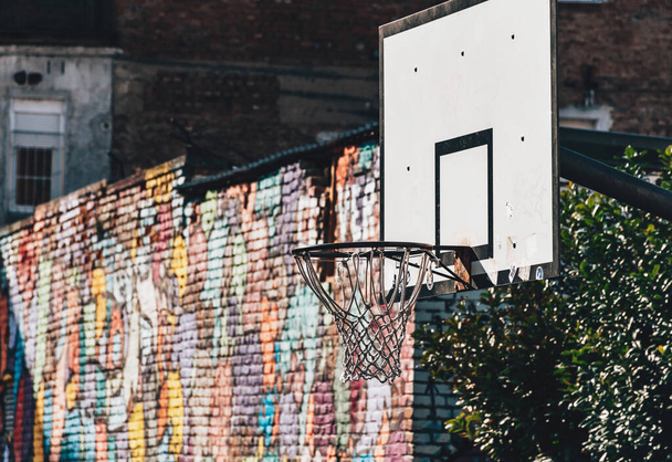 ZAGREB, CROATIA - Mar 25, 2021: Basketball hoop with brick wall in background. Graffiti, neighborhood, neighbourhood, sports, recreation, no people. - Photo, Image