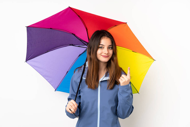 Nainen pitämällä sateenvarjo eristetty valkoisella taustalla osoittaa etusormella loistava idea - Valokuva, kuva