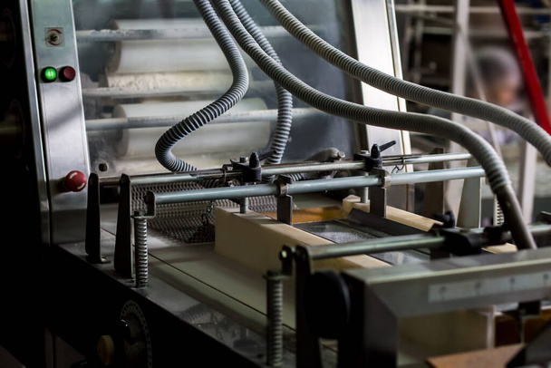 Close up of automated technology at confectionery factory. - Photo, Image