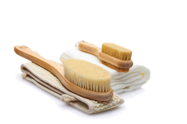 A set of items from natural materials for body care isolated on a white background. Dry massage brush, washcloth, pumice stone. Self-care concept - Foto, immagini