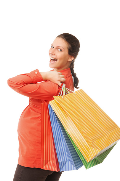 Pregnant woman holding shopping bags isolated - Photo, image