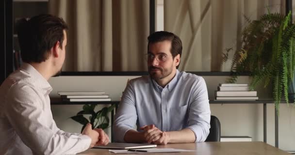 Happy young hr manager holding job interview with applicant. - Πλάνα, βίντεο