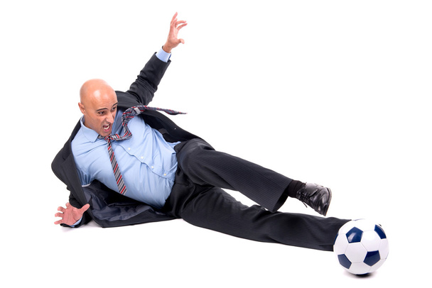 Businessman playing soccer - Фото, изображение