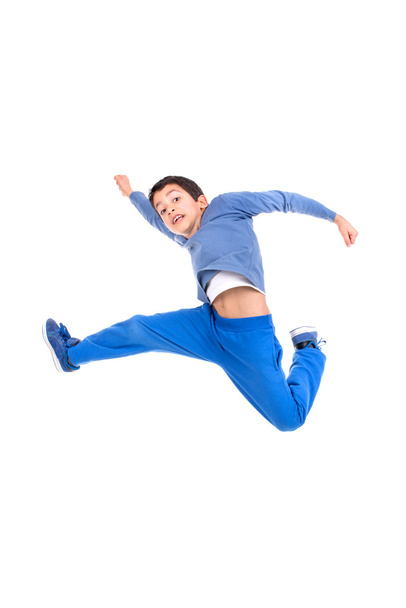 Young boy jumping - 写真・画像