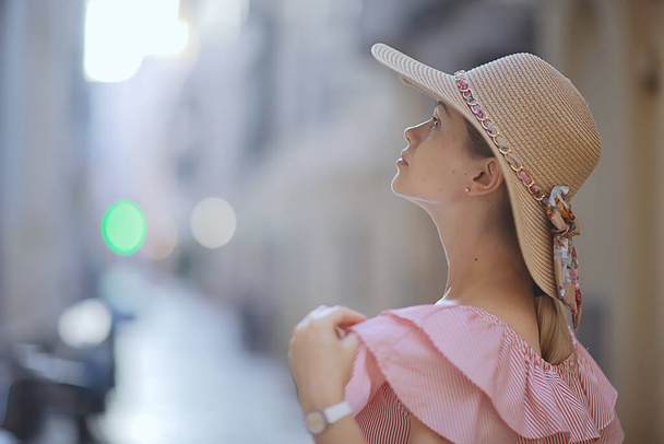 tourism summer old town female, europe mediterranean, young woman traveler, back straw hat view - Photo, Image