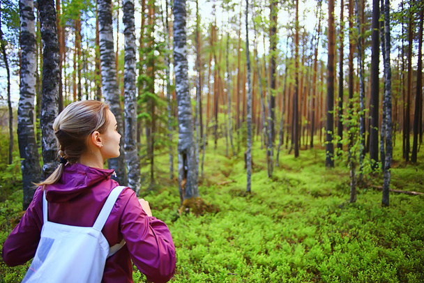 spring forest female windbreaker trekking, springtime rest nature landscape background woman tourist - Photo, image