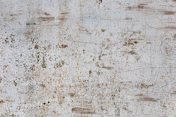 Old gray painted metal surface with cracks and scratches. Grunge texture. - Фото, изображение