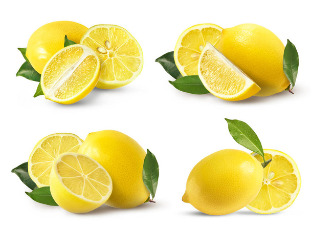 A creative set with Fresh ripe raw lemons with green leaves isolated on white background. Whole and cut yellow lemon collection, high resolution image - 写真・画像