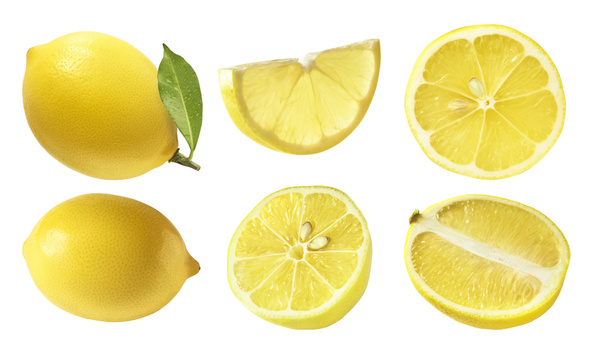 A creative set with Fresh ripe raw lemons with green leaves isolated on white background. Whole and cut yellow lemon collection, high resolution image - Foto, Imagen
