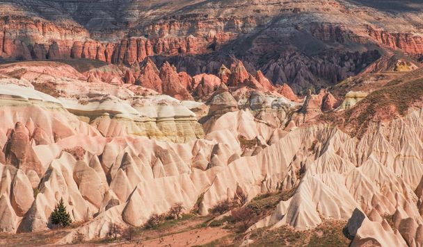 Canyon and rocks in the red valley of Cappadocia in Turkey - 写真・画像