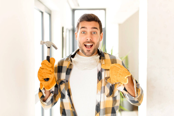 handyman feeling happy, surprised and proud, pointing to self with an excited, amazed look - Photo, Image