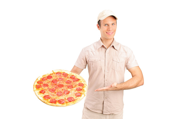 Delivery guy holding a pizza  - Photo, image