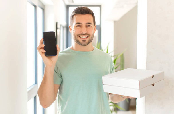 young handsome man with take away pizza boxes at home - Foto, Imagem