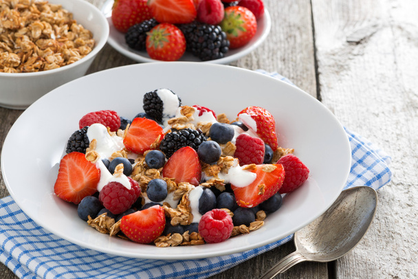 Breakfast with fresh berries, yogurt and homemade granola - Photo, image