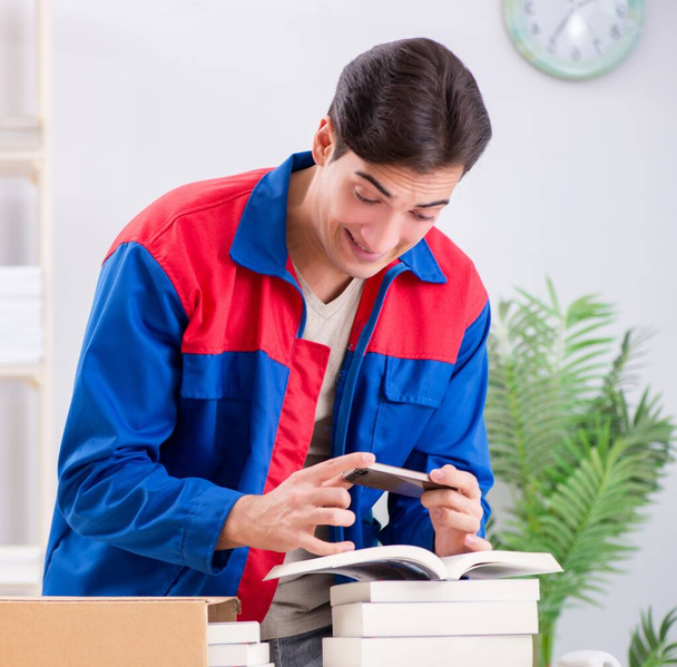 Worker in publishing house preparing book order - Photo, Image