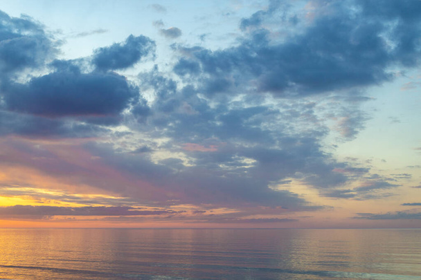Summer mood. Beautiful colorful sunset over Baltic sea in Jurmala, Latvia - Фото, зображення
