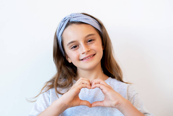 supportive kid love sign happy girl heart gesture - Foto, Imagen
