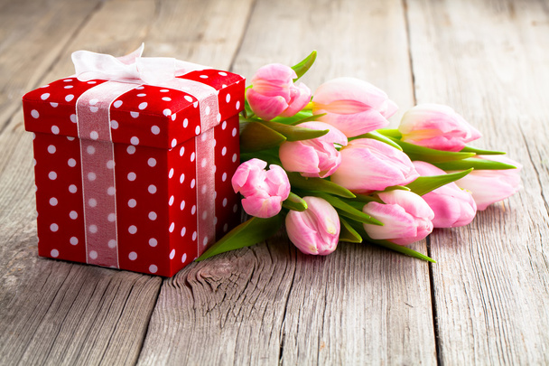 beautiful tulips with red polka-dot gift box. happy mothers day, - Foto, Imagen
