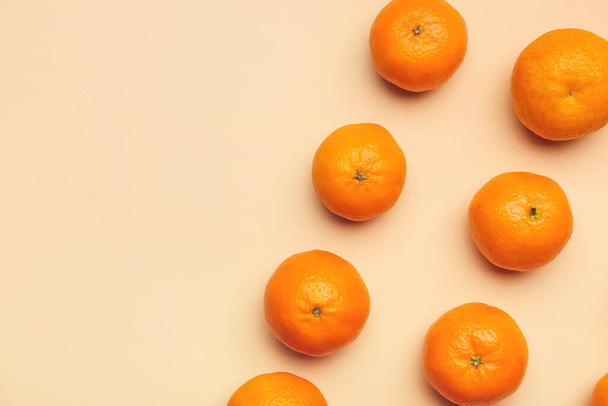 Sweet tangerines on color background - 写真・画像